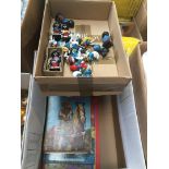 A box of annuals, Golly Bandsmen and Smurfs figurines