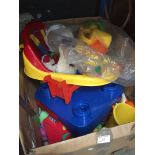 A large box of plastic and soft toys