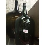 2 large glass bottles