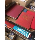 2 boxes of stamp albums