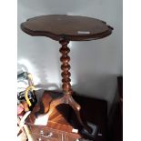 A Victorian tripod table.