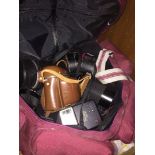 A bag of cameras and lenses