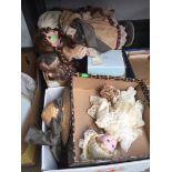 2 boxes containing various dolls