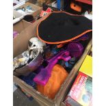 A box of assorted fancy dress costumes and Halloween items
