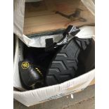 A box containing sport shoes, wellies, few records and some weights