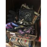 A box of evening bags and leather gloves