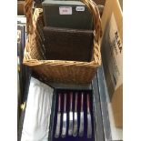 3 cases of plated cutlery in a basket