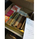 A box containing London transport ephemera and vintage topography books