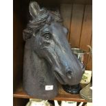 A plaster horses head.