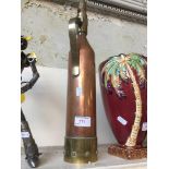 A copper and brass Teletetra fire extinguisher.