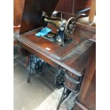 A Singer tressle sewing machine