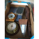 A box containing a metronome and barometers etc