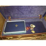 A masonic case containing a masonic bible and three masonic meda;s