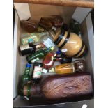 A box containing miniature bottles with spirits, etc