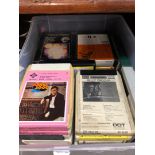 A box with 8 track stereo tapes