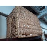 A wicker hamper or basket.