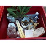 Red crate with small brass candlesticks, pottery and glass