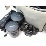 Olympus OM2 camera and lenses etc. in a bag