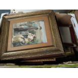 A box of picture frames and pictures