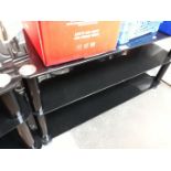 A black glass TV stand.