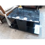 A black glass TV stand.