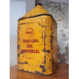 A Shell five gallon tractor oil can.