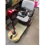 A Sunrunner mobility scooter with charger and key ( may require new battery, battery doesn't hold