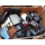 A box of cameras, lenses, bags etc