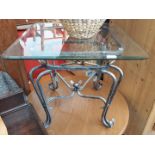 A glass top metal framed table.