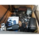 A box of cameras and camera equipment including lenses, etc