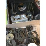 A box with quantity of clock cases and parts