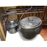 A large 6 Gal. cast metal cooking pot by Beech Hill & Co. and a cast metal kettle