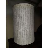 A white woven painted linen basket