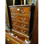 A reproduction small chest of drawers