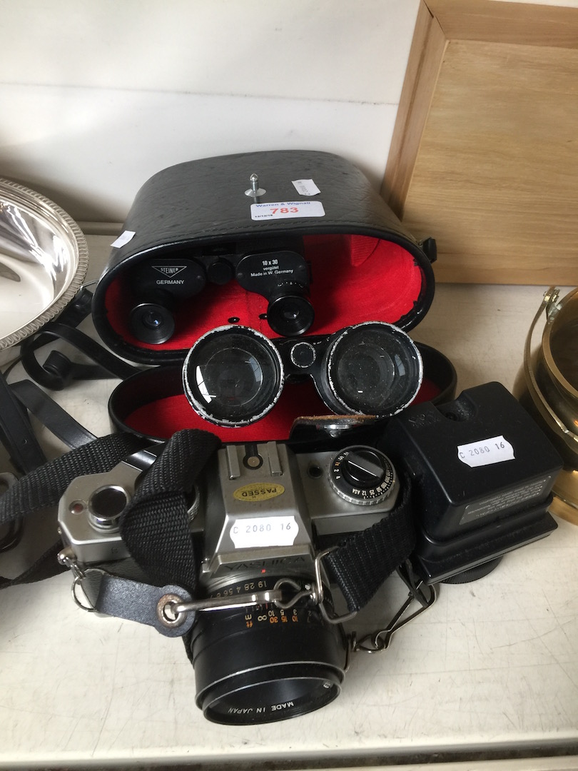 2 pairs of binoculars and a Yashica camera