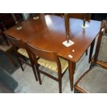 A Danish style teak extending dining table and 4 chairs