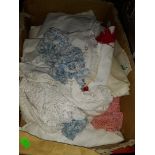 A box of crochetware, doilies, etc