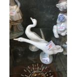 Two Lladro geese - one damaged