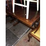 An oak drawer leaf table