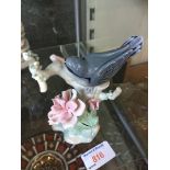 Lladro bird on a branch