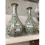 A pair of Royal Doulton vases "Persian design" - one repaired