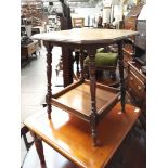 An Edwardian 2 tier occasional table with turned legs