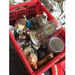 Red crate of clocks and pottery ornaments