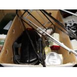 A box of cycle accessories including lamps, panier supports, etc