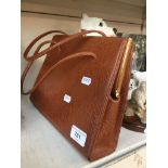 A ladies brown handbag