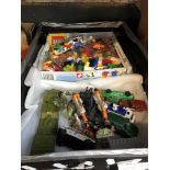 A box containing Lego and other toys