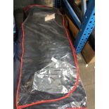 A large bag of motor cycle leathers