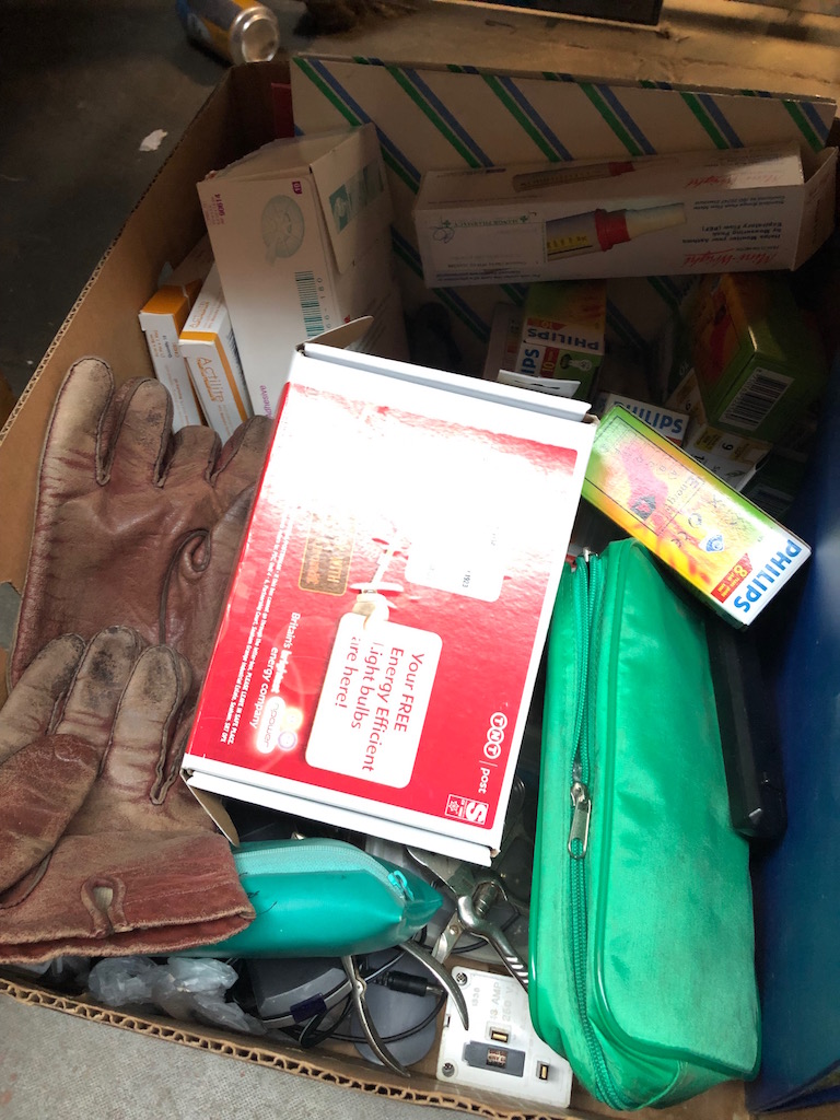 A box of misc including light bulbs, first aid kit etc