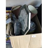 A box of misc icluding a clock, table lamp, large torch and an alarm clock radio