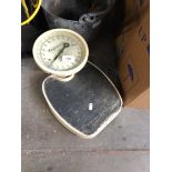 Weighing scales and a galvanised bucket